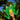 Hand holding a green frog plush toy with a blurred natural background